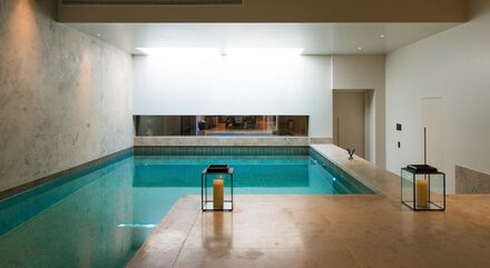 Bedford Gardens uses heated frameless glass to basement
